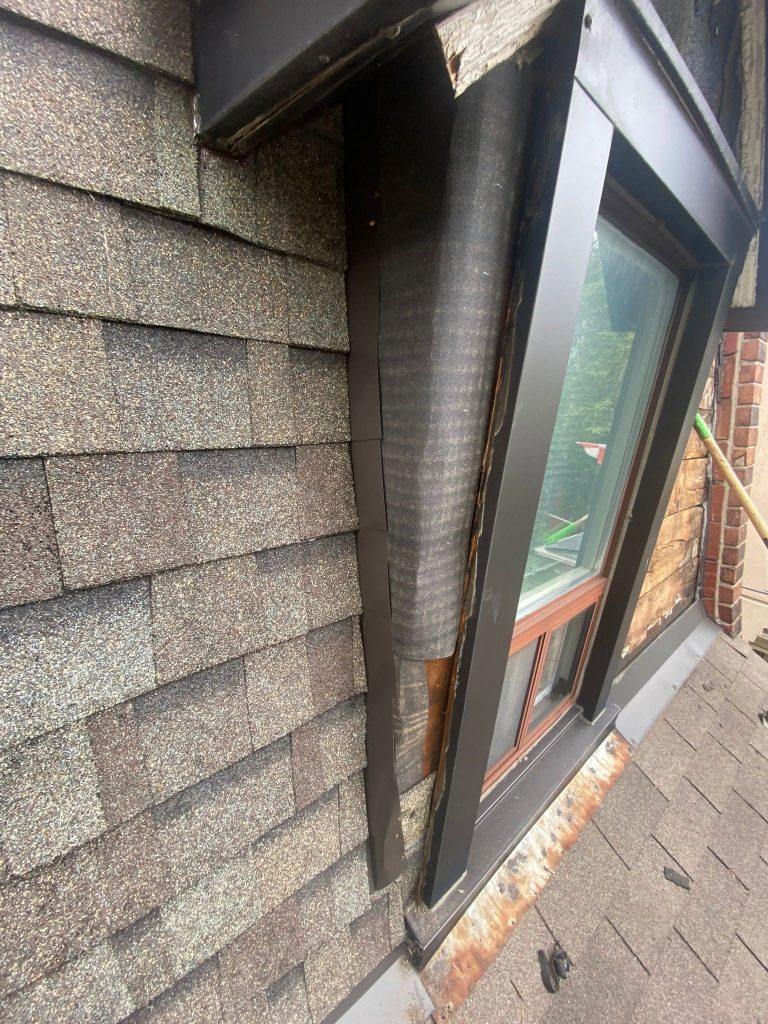 Dormer window with new metal flashing and underlayment before shingles go on