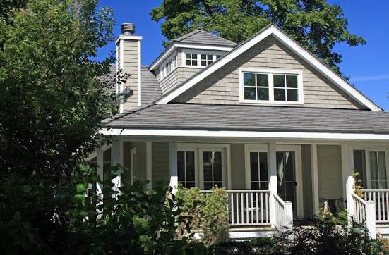 Shingle roof on a cedar-sided house
